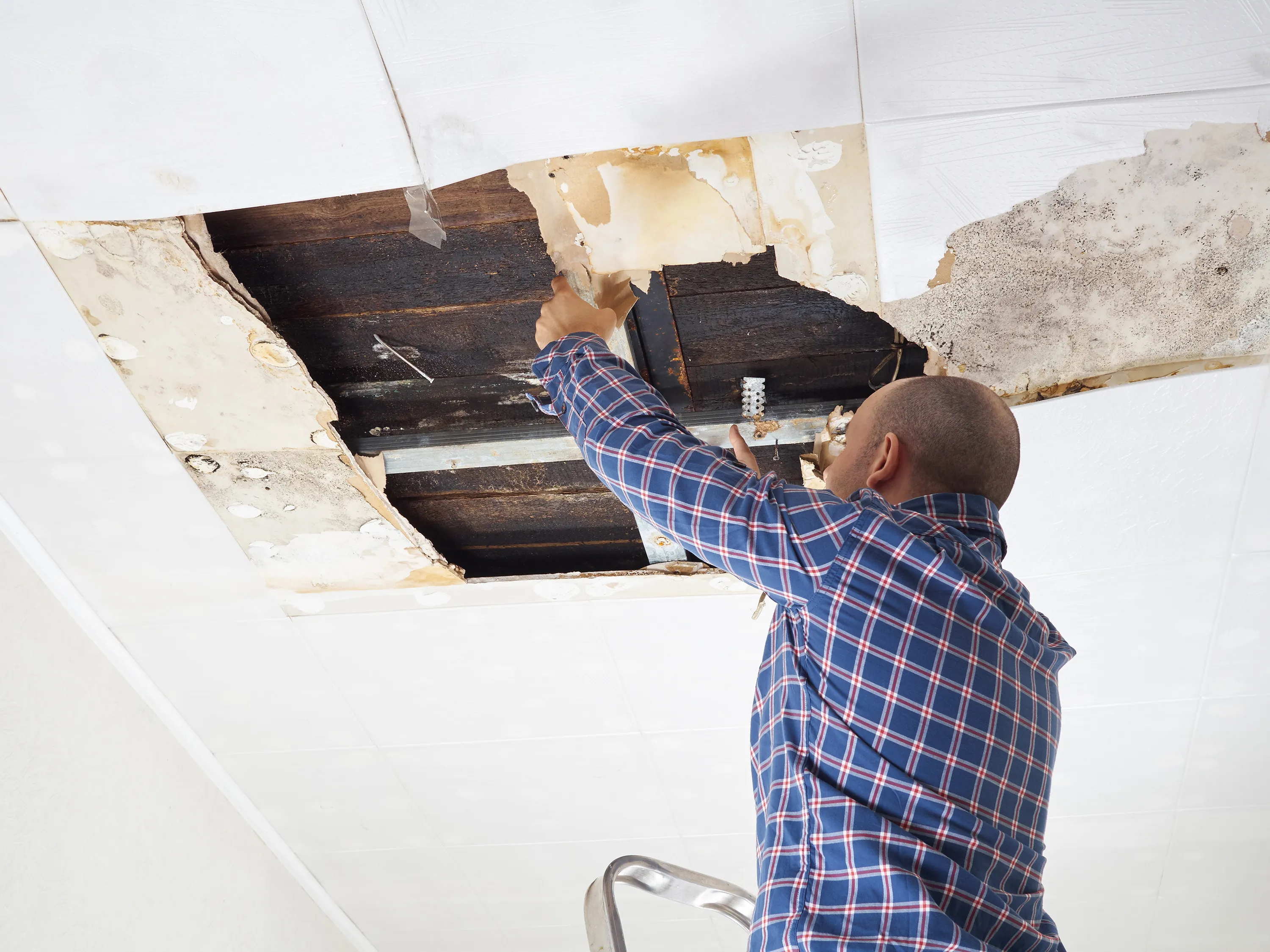 Interior ceiling and finish work during a water-damage repair.